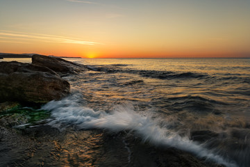Obraz premium Beach sunset of the sea with sky and cloud in twilight over light the sun, Long exposure technique, Dramatic sea with sea sunset and sea in twilight, Sea sunset and sea sunrise with sea twilight