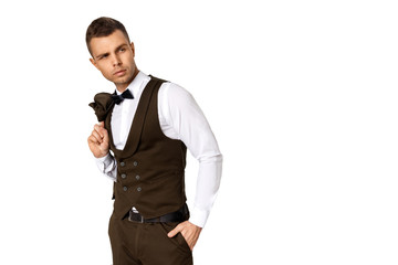Fototapeta premium Man in tuxedo and vest in white shirt on white background