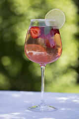 Homemade Summer Berry Drink. Lemonade with  strawberry with lime, mint in glass