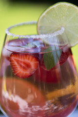 Homemade Summer Berry Drink. Lemonade with  strawberry with lime, mint in glass