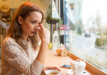 Crying woman in cafeteria