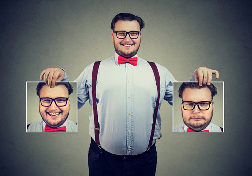 Cheerful man showing different photos with emotions