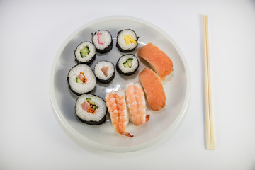 Japanese food Sushi on white plate with japanese chopsticks on white background