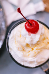 Close up Sweet refreshing Cherry Cola topping with a scoop of vanilla ice cream and fresh cherry.