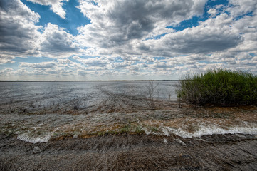 The flood of the river Don. Dangerous water level on the road towards Tryokhostrovskaya ferry station.