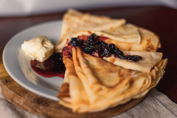 Pancakes with blueberry syrup and butter