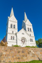 Fototapeta premium Majestic white Church of the Heart of Jesus in Slobodka, Belarus. The combination of Gothic and Roman style