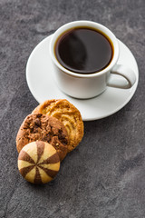 Cup of coffee and sweet cookies.