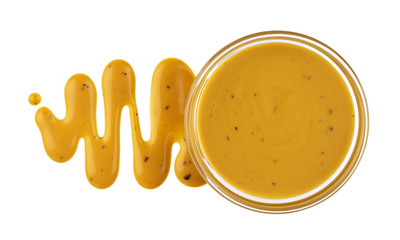 Mustard sauce in bowl isolated on white background. Top view