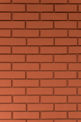 Strong red vertical brick wall background, surface. Red, orange tiles.