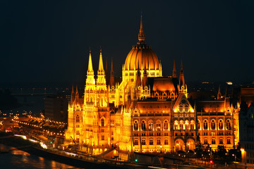 Fototapeta na wymiar Hungarian Parliament in Budapest by the Danube river in sunset light