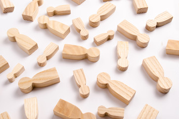 Wooden figures of people are lying on a white background. The concept of human resources management. Headhunters. Search for people to work. The search for the second half. Social network. Business