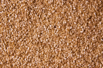 Sesame seeds background texture, close-up. View from above, horizontal 