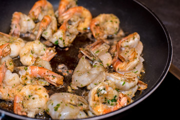 Jumbo Shrimp Scampi Sauteeing in Butter and Olive Oil