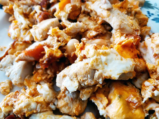 Close-up of a fried eggs with poultry and beans