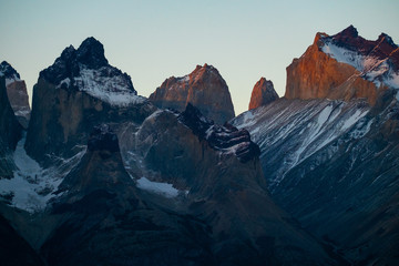 Mountains covered with snow at sunset. Part of mountains of Torres del Paine National Park during sunset, Chile