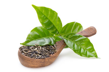 Green tea leaf the spoon isolated on white background.