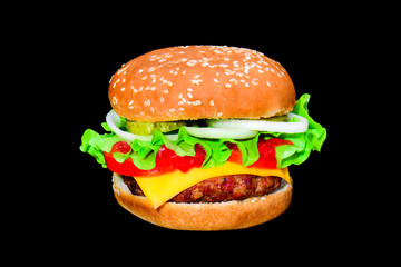 Big tasty hamburger or cheeseburger isolated on black background with grilled meat, cheese, tomato, bacon, onion. Burger closeup