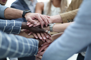 Obraz na płótnie Canvas Close-Up of hands business team showing unity with putting their hands together
