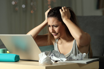 Frustrated student discovering mistake online