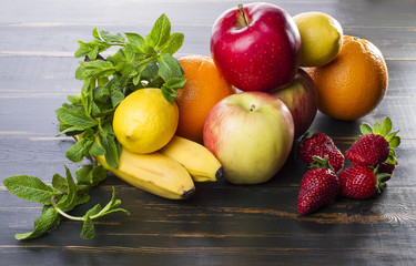 dietary healthy food fresh fruit and berries on a wooden table