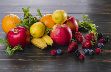 dietary healthy food fresh fruit and berries on a wooden table