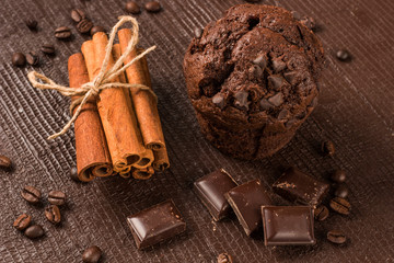 chocolate muffin with cinnamon sticks