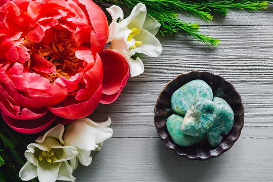 Amazonite on White Table with Tulip and Peony Flowers