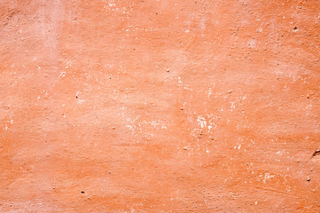 Texture of old wall covered with brown stucco