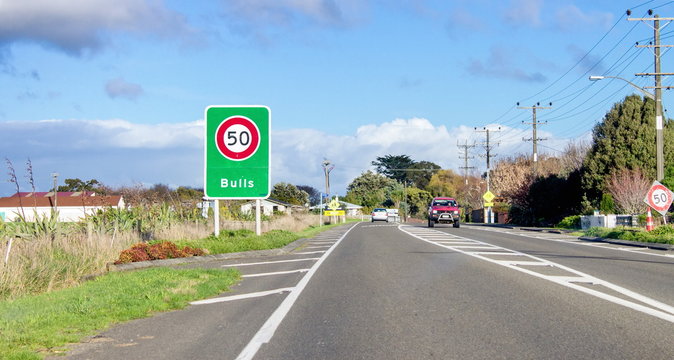 Road sign designating a fifty kilometer per hour speed zone travelling through the town of Bulls in the Rangitikei District. of New Zealand