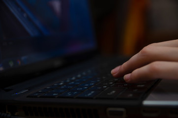 beautiful girl hands lie on the keyboard