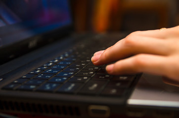 beautiful girl hands lie on the keyboard
