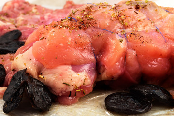 Prepared for roasting meatloaf with prunes.