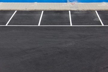 Fototapeta premium Free parking lots. Vacancy, empty space, new asphalt concept