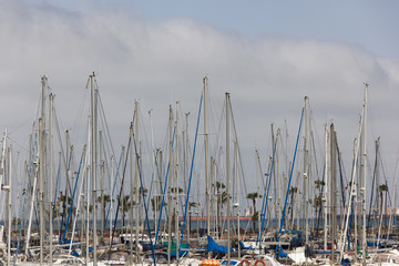 Mast of sailboats in nautical club of Las Palmas, Canary Islands. Marine pier in Gran Canaria, Spain. Luxury transportation concept