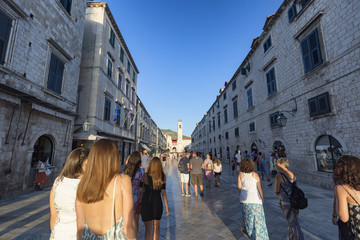 Naklejka premium DUBROVNIK, CROATIA - AUGUST 10: Unidentified people walking down the main road in the old city of Dubrovnik, Croatia on August 10, 2016.