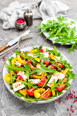 Chicken salad. Meat salad with fresh tomato, sweet pepper, arugula and grilled chicken breast. Chicken fillet with fresh vegetable salad
