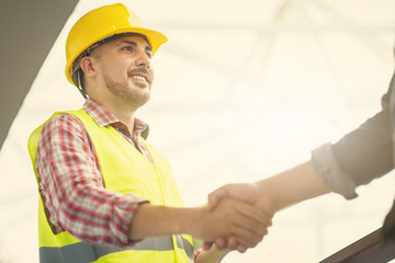 Engineer worker shaking hand with customer or co worker in the office