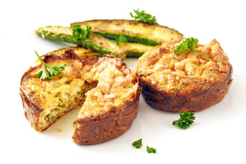 vegetable patties with roasted mini zucchini and parsley garnish on a white background with copy...