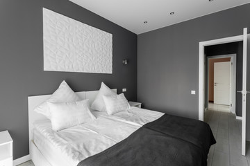 daylight morning. Hotel standart room. modern bedroom with white pillows. simple and stylish interior.