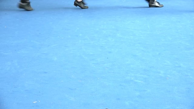 Tap dance stage at jazz festival, close up of legs movement with tap shoes. Dancers moving at recital, live with shiny light on blue background. Vintage music, leisure and recital culture. Copy space