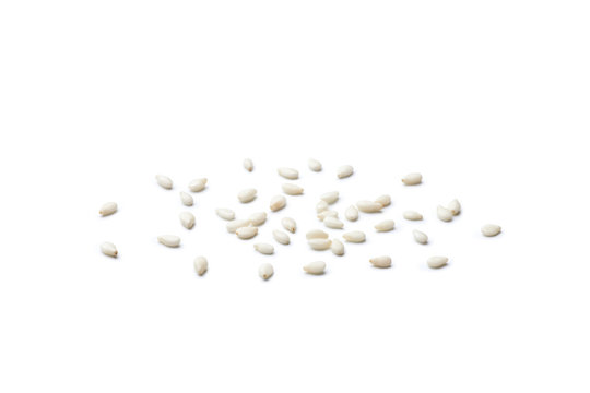 White sesame seeds on white background