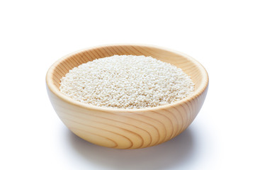 White sesame seeds in a wooden bowl