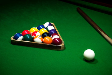 Billiards balls on the green table