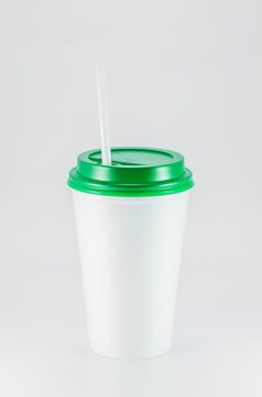 White Plastic Coffee Cup With Green Lid On White Background, View From Above With Copy Space