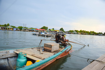 Thai fishing boat used as a vehicle for finding fish in the sea.at sunset