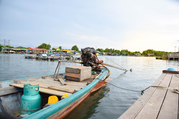 Thai fishing boat used as a vehicle for finding fish in the sea.at sunset