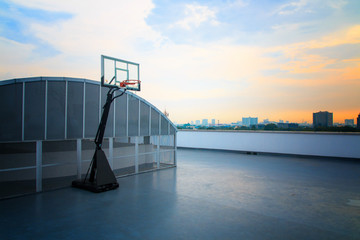 Basketball court on rooftop, evening sunset time
