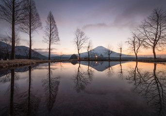 Mountain Fuji and Lake Tanumi with beautiful sunrise in winter season. Lake Tanuki is a lake near Mount Fuji, Japan. 