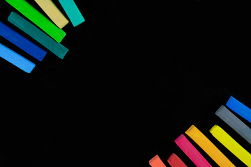 Colourful chalk pastel on black background, Concept of education background.